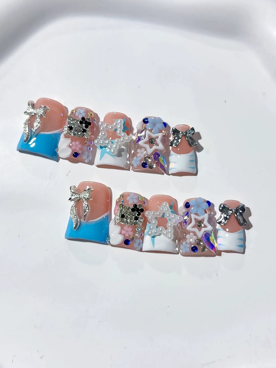 Nude Blue White Silver Abstract Bow Flower Star Rhinestone 3D press on nails detail view