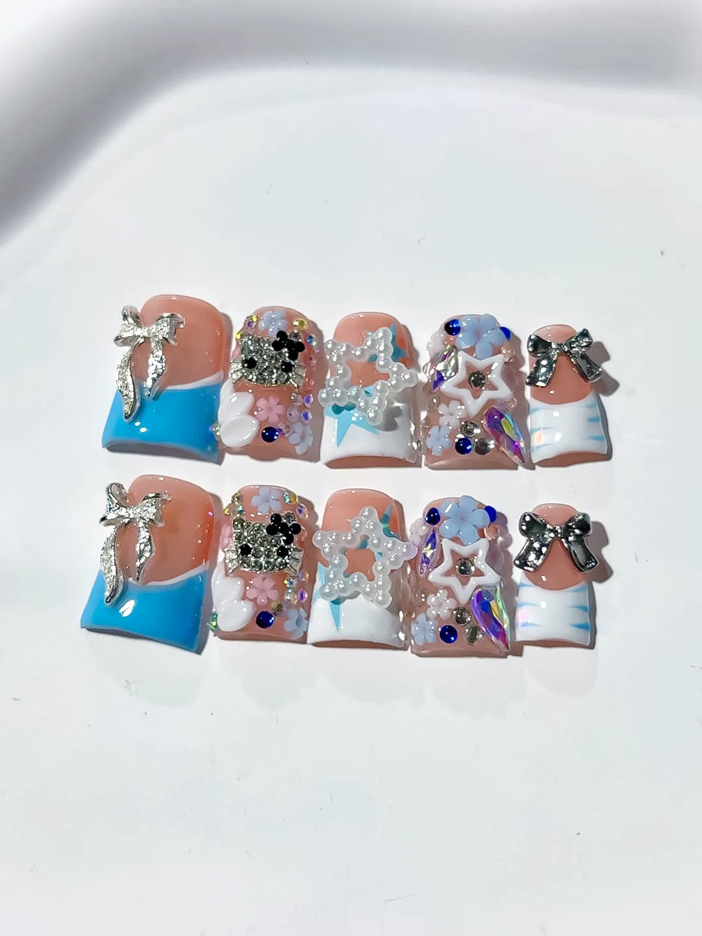 Nude Blue White Silver Abstract Bow Flower Star Rhinestone 3D press on nails detail view
