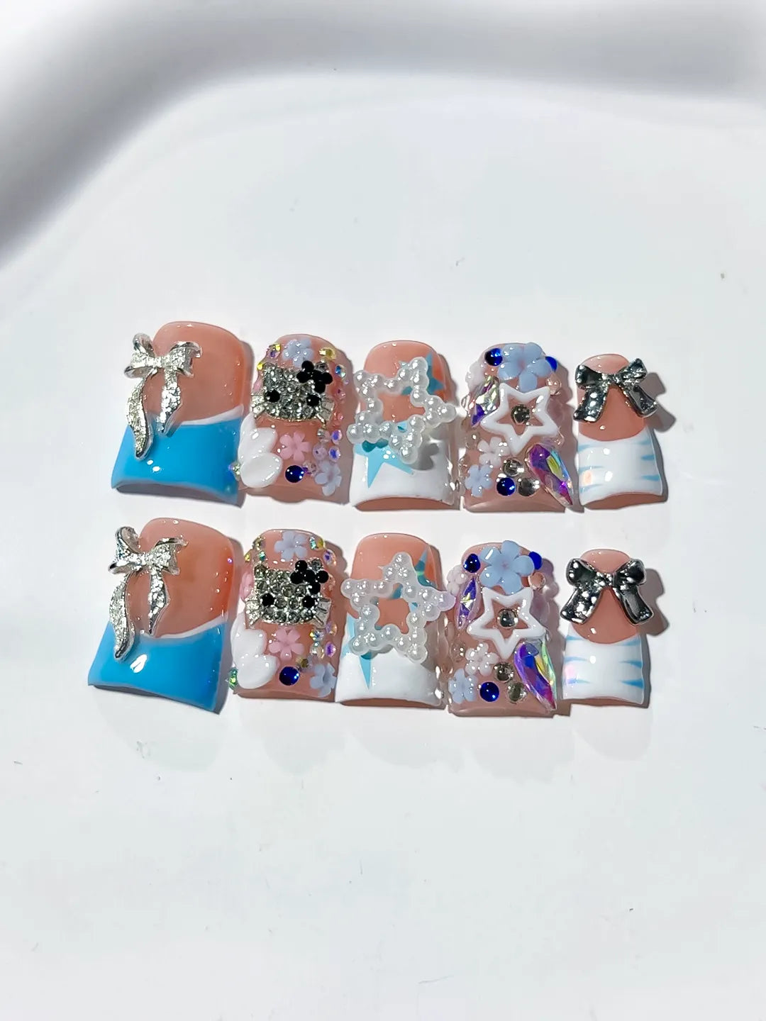 Nude Blue White Silver Abstract Bow Flower Star Rhinestone 3D press on nails detail view