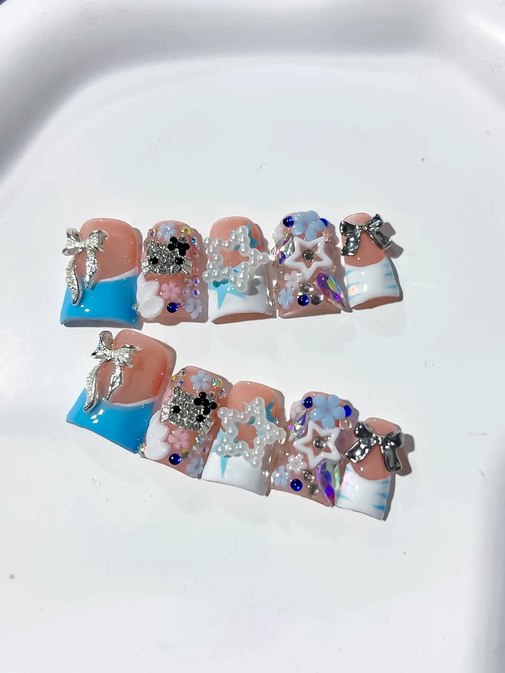 Nude Blue White Silver Abstract Bow Flower Star Rhinestone 3D press on nails detail view
