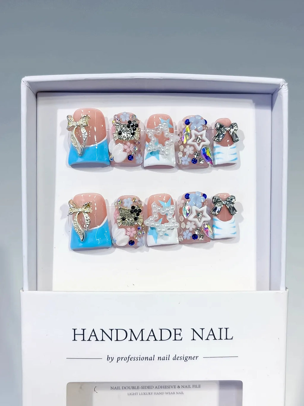 Nude Blue White Silver Abstract Bow Flower Star Rhinestone 3D press on nails full set view