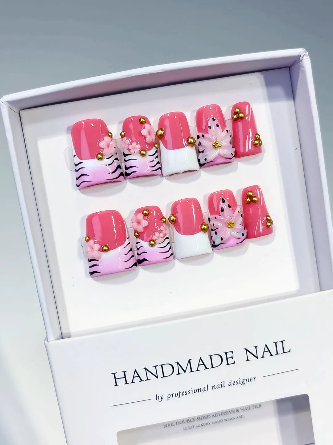 Pink White Black Gold Abstract Flower Animal Print Stud press on nails angled view