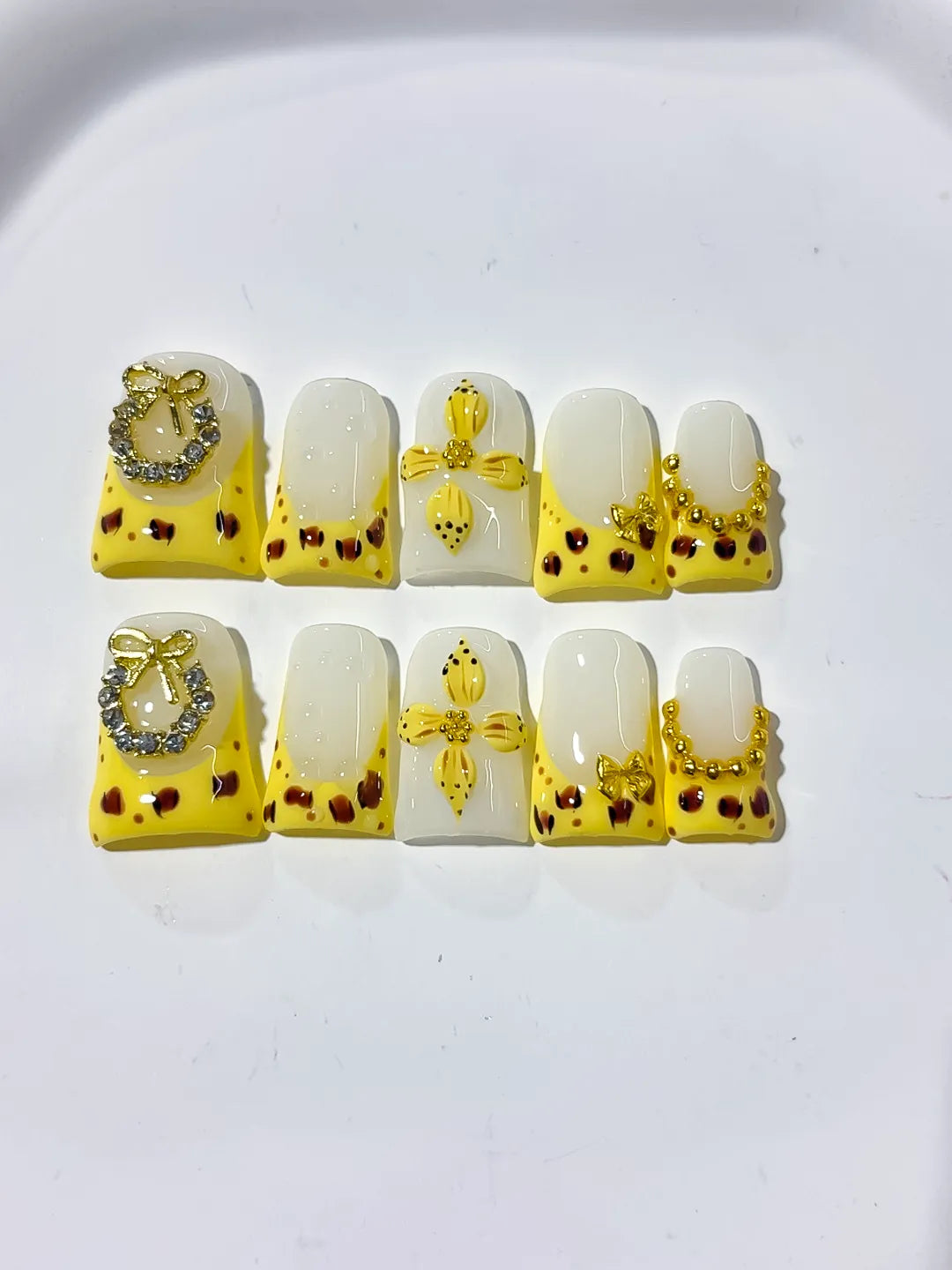 Yellow White Gold Black French tip Bow Heart Rhinestone press on nails close up