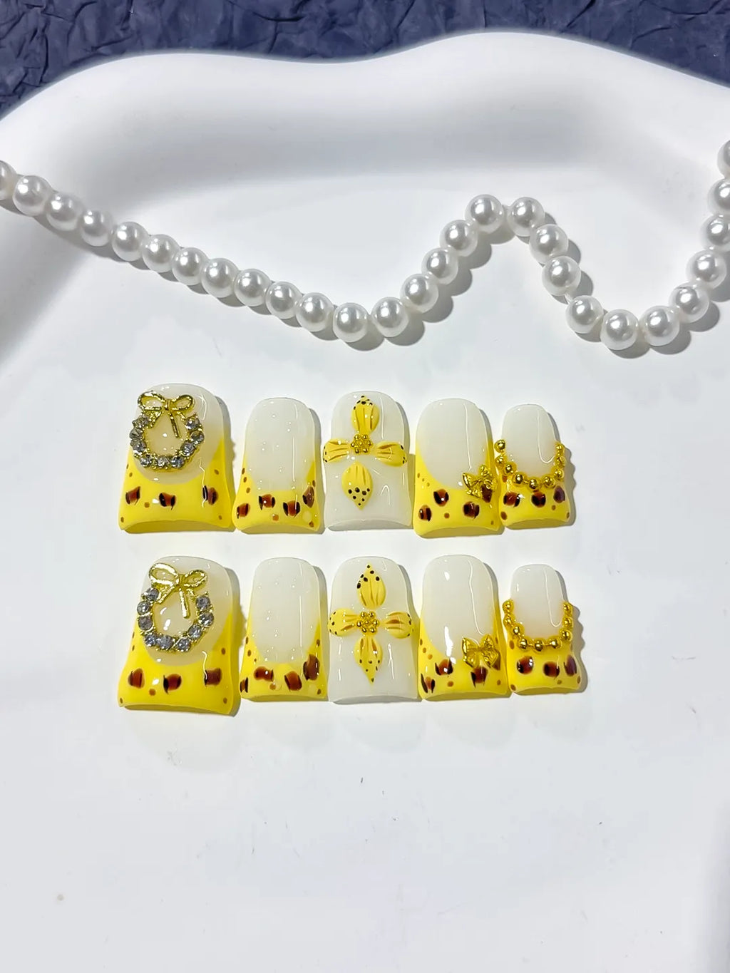 Yellow White Gold Black French tip Bow Heart Rhinestone press on nails detail view