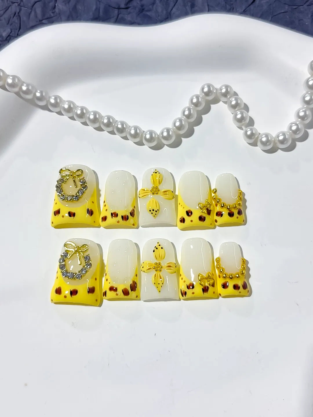 Yellow White Gold Black French tip Bow Heart Rhinestone press on nails detail view