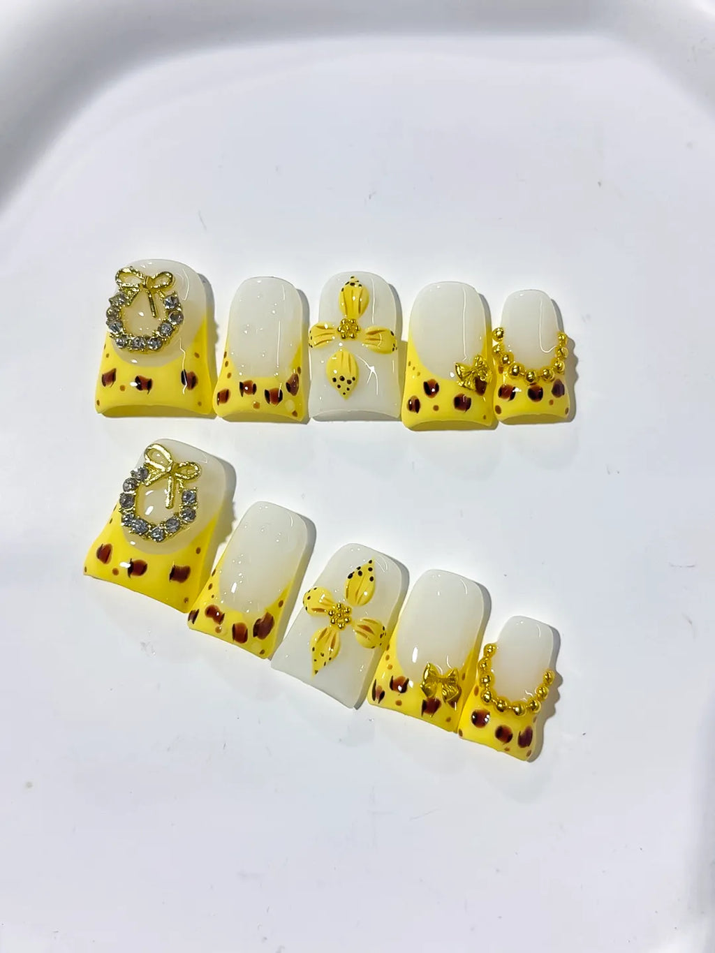 Yellow White Gold Black French tip Bow Heart Rhinestone press on nails detail view
