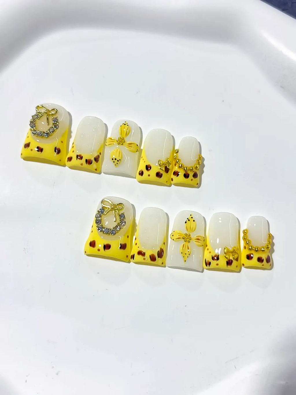 Yellow White Gold Black French tip Bow Heart Rhinestone press on nails detail view