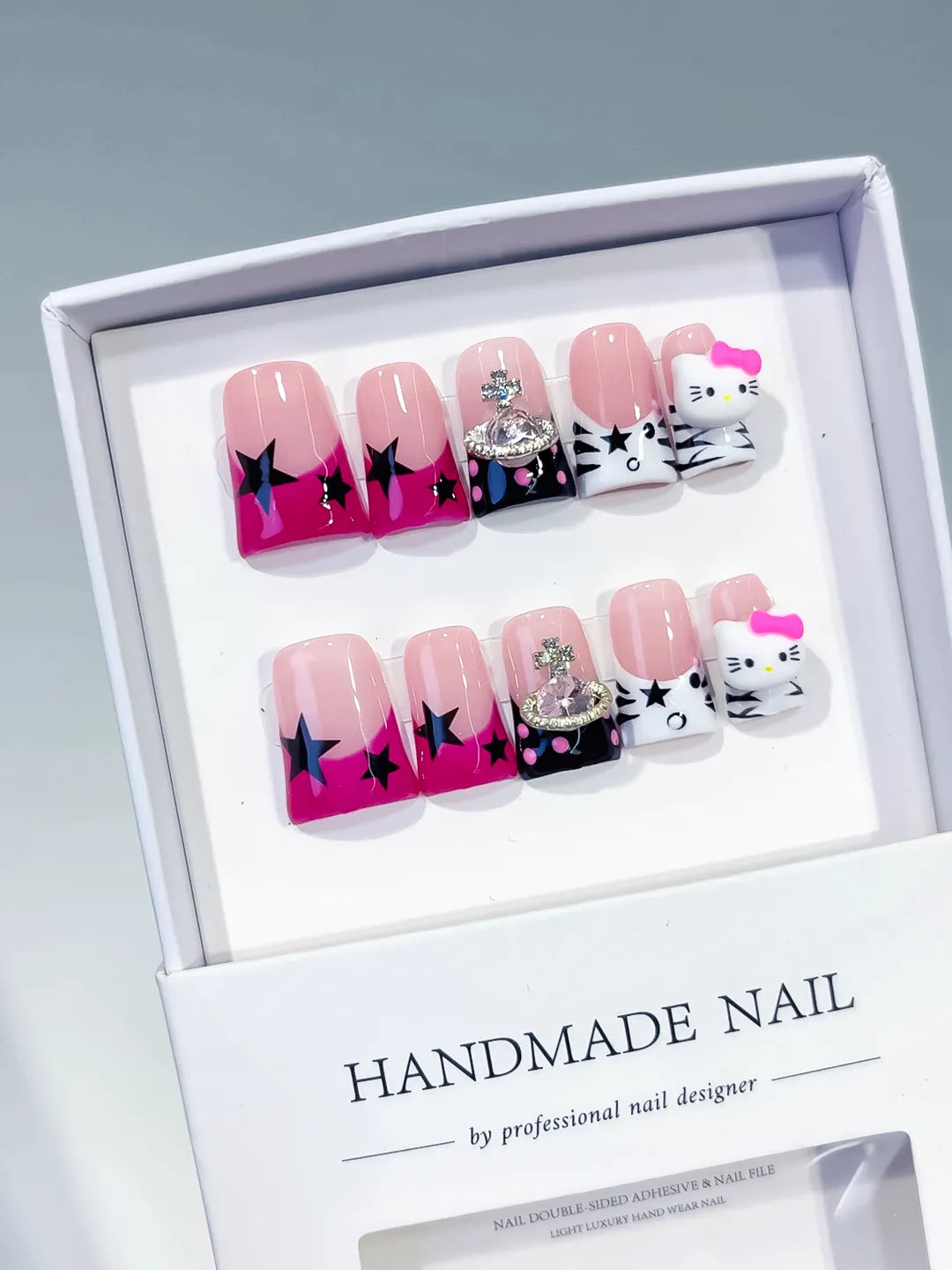 Pink White Black French tip Bow Hello Kitty 3D press on nails angled view