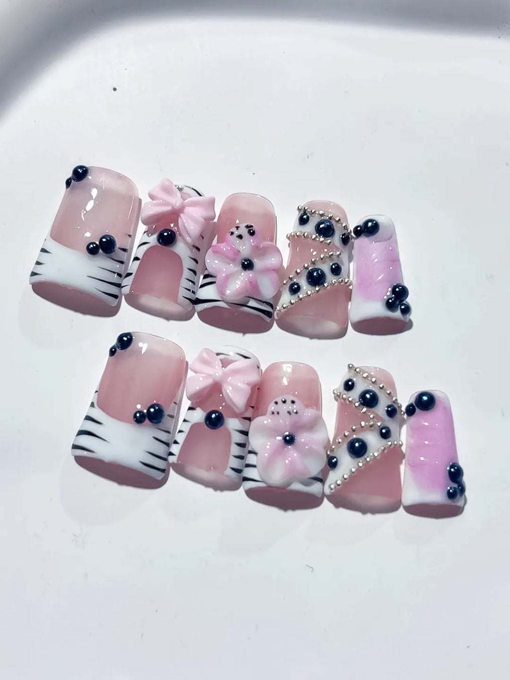 Pink White Black Abstract Bow Flower Pearl 3D press on nails detail view