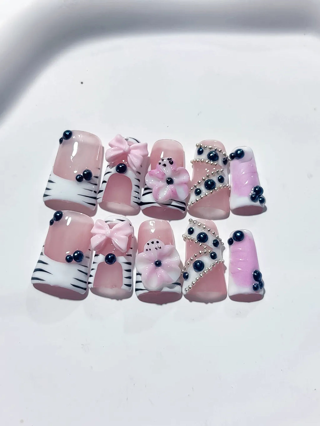 Pink White Black Abstract Bow Flower Pearl 3D press on nails detail view