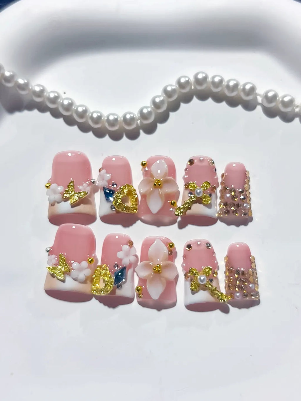 Pink White Gold Blue Abstract Flower Butterfly Heart Rhinestone press on nails detail view
