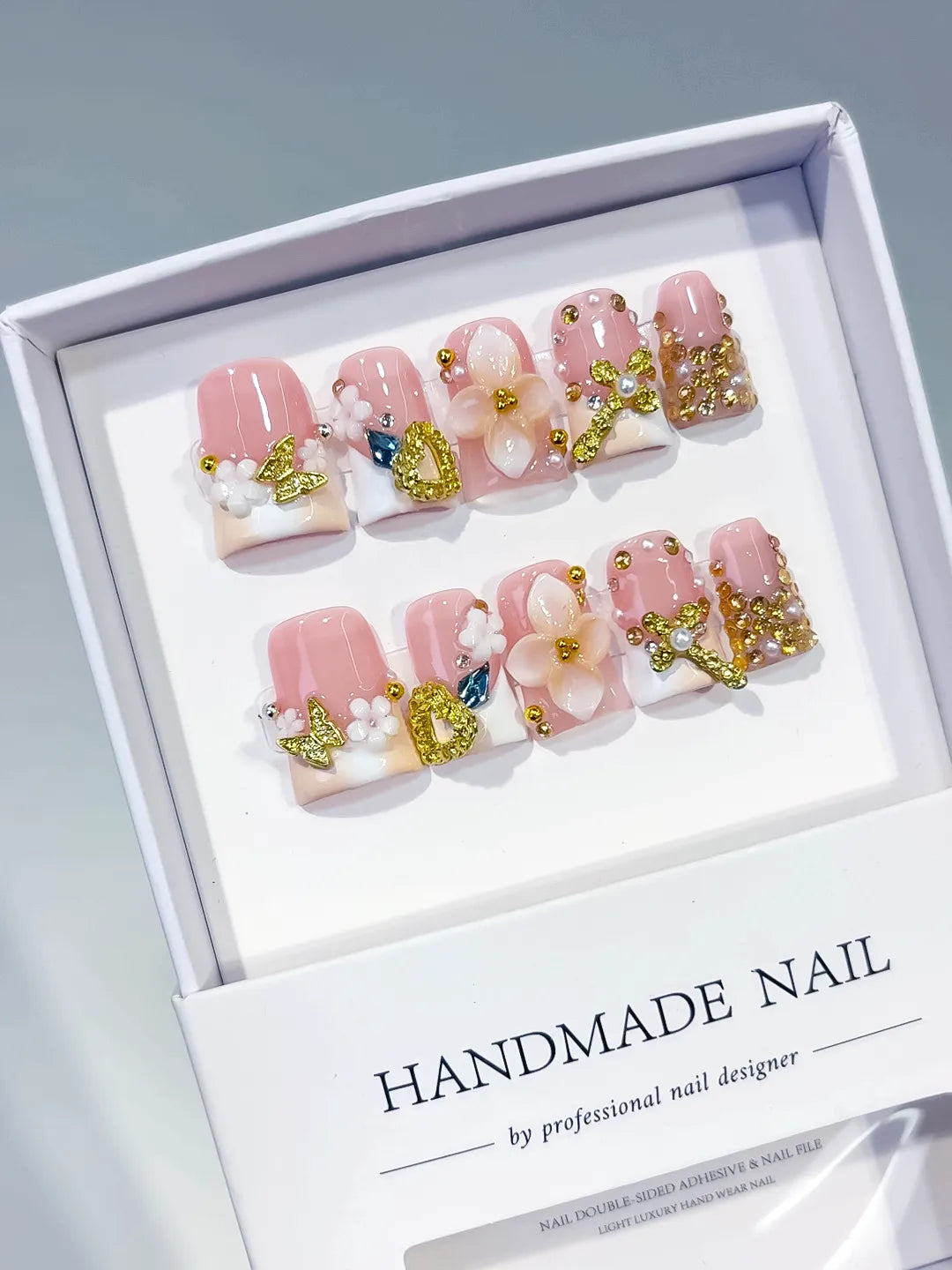 Pink White Gold Blue Abstract Flower Butterfly Heart Rhinestone press on nails angled view