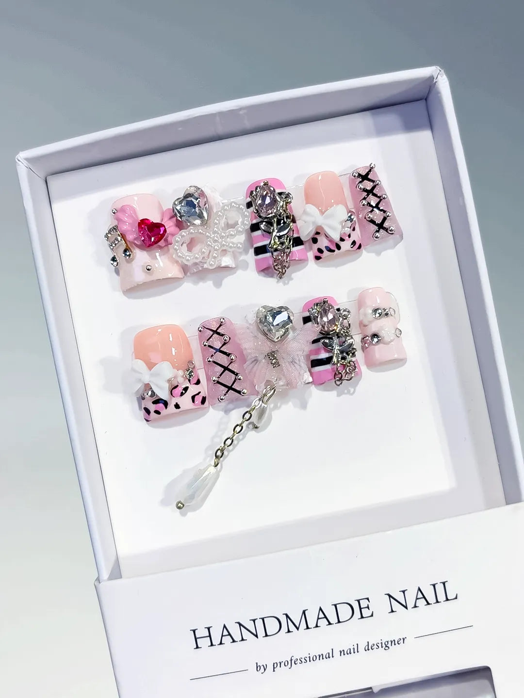 Pink White Black Silver Abstract Bow Heart Cross Lattice Chain Rhinestone 3D press on nails angled view