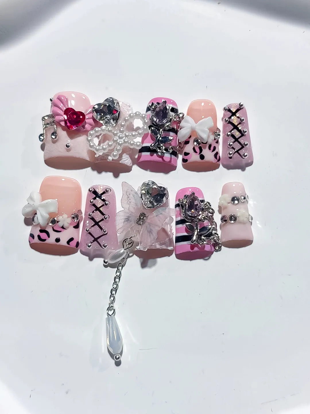 Pink White Black Silver Abstract Bow Heart Cross Lattice Chain Rhinestone 3D press on nails close up