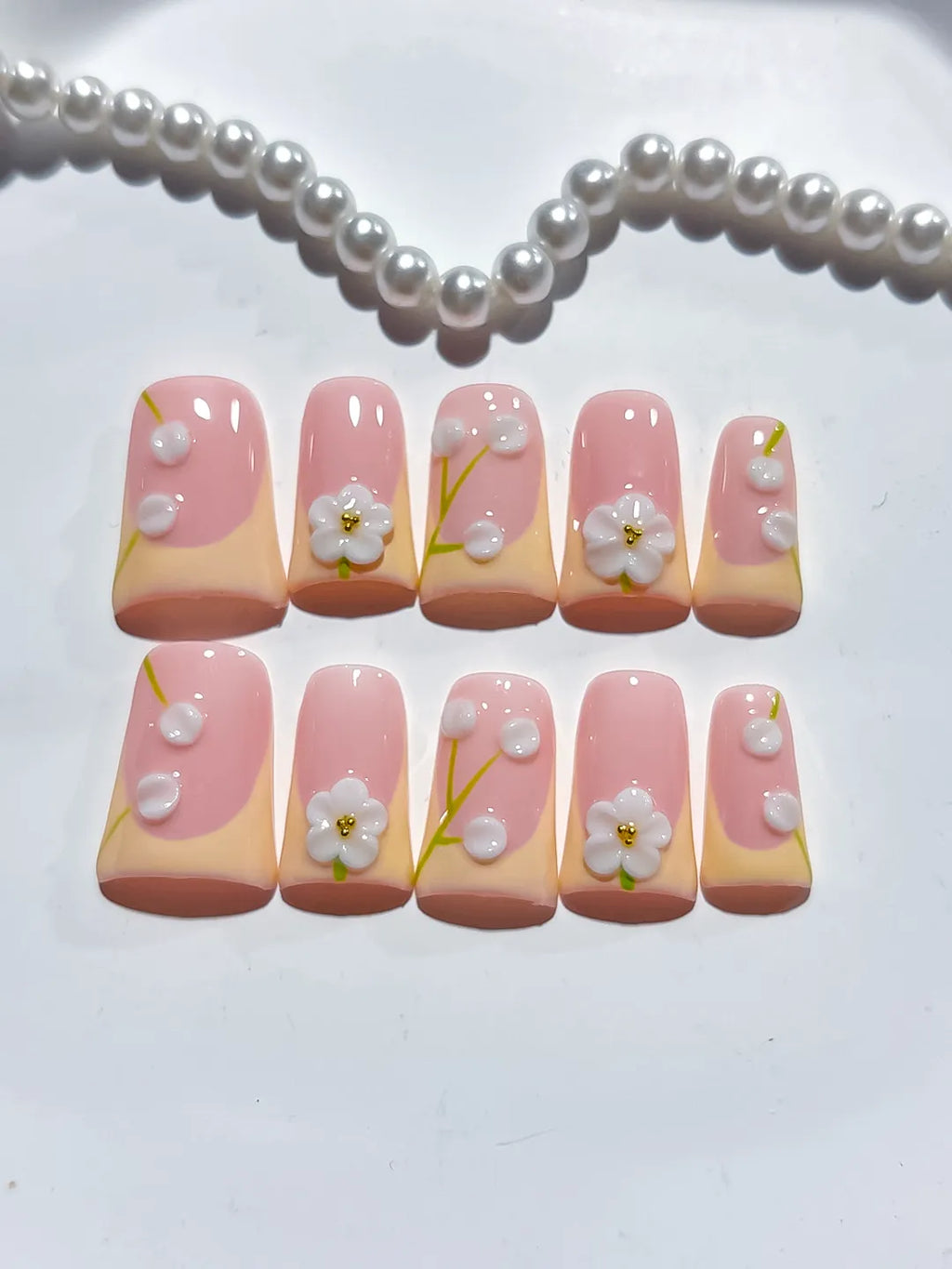 Pink Nude White French tip Flower Pearl 3D press on nails close up