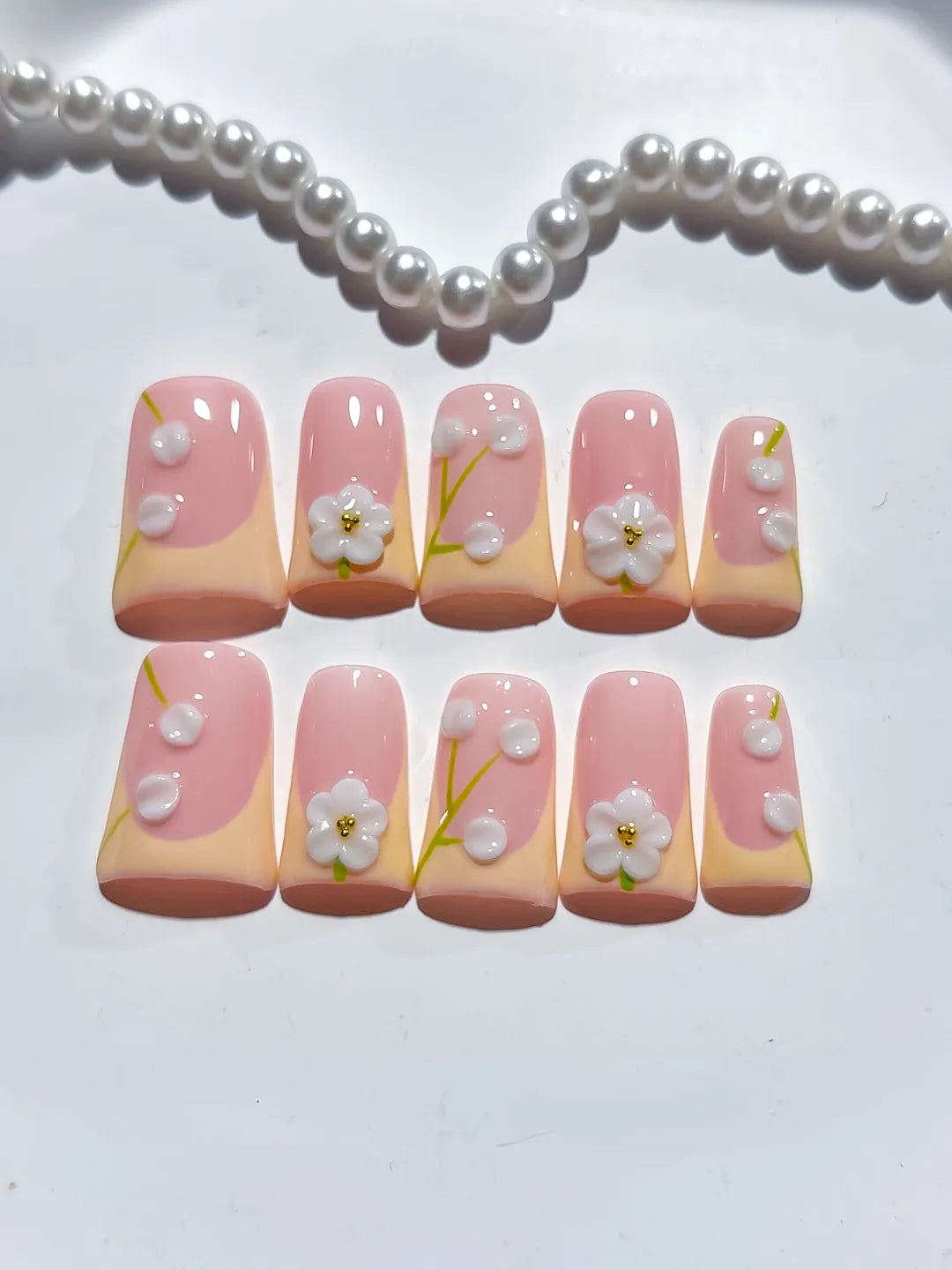 Pink Nude White French tip Flower Pearl 3D press on nails close up