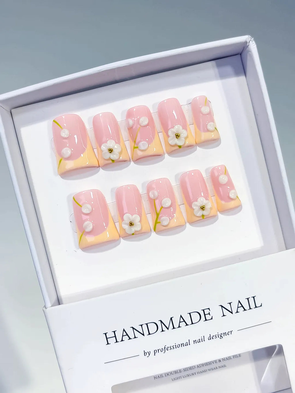 Pink Nude White French tip Flower Pearl 3D press on nails angled view