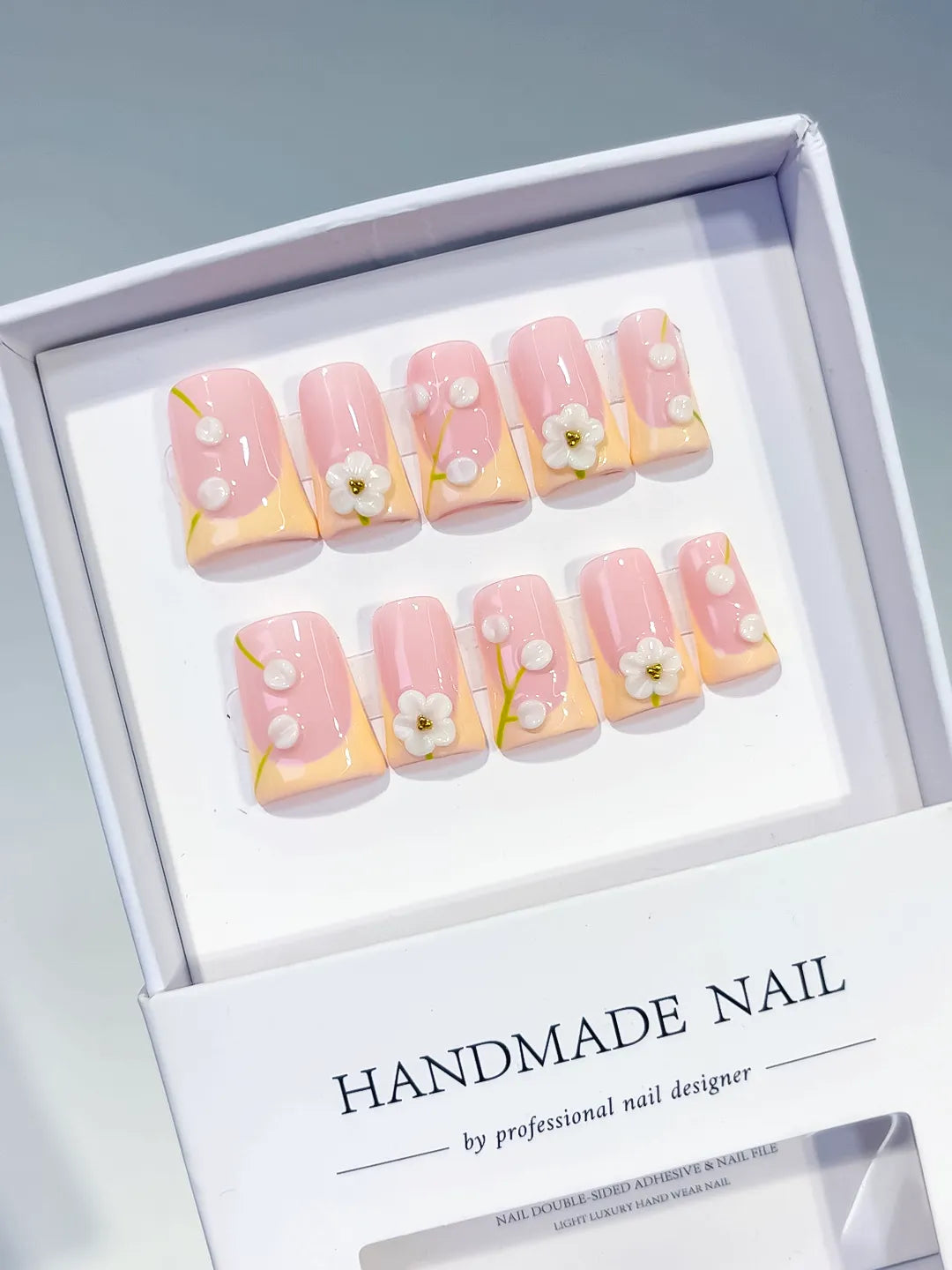 Pink Nude White French tip Flower Pearl 3D press on nails angled view