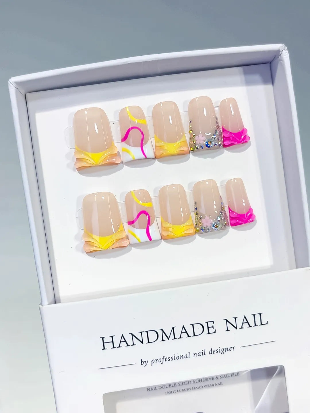 Nude Yellow White Pink Silver Abstract Heart Rhinestone press on nails angled view