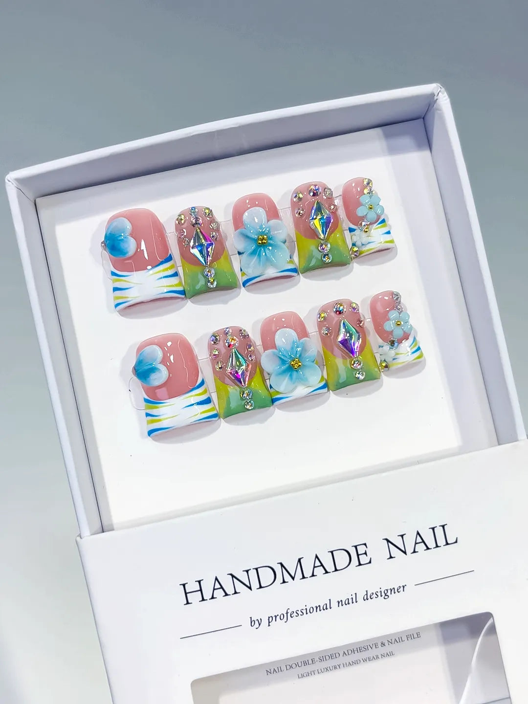 Nude Blue Green Yellow Silver Abstract Flower Rhinestone 3D press on nails angled view