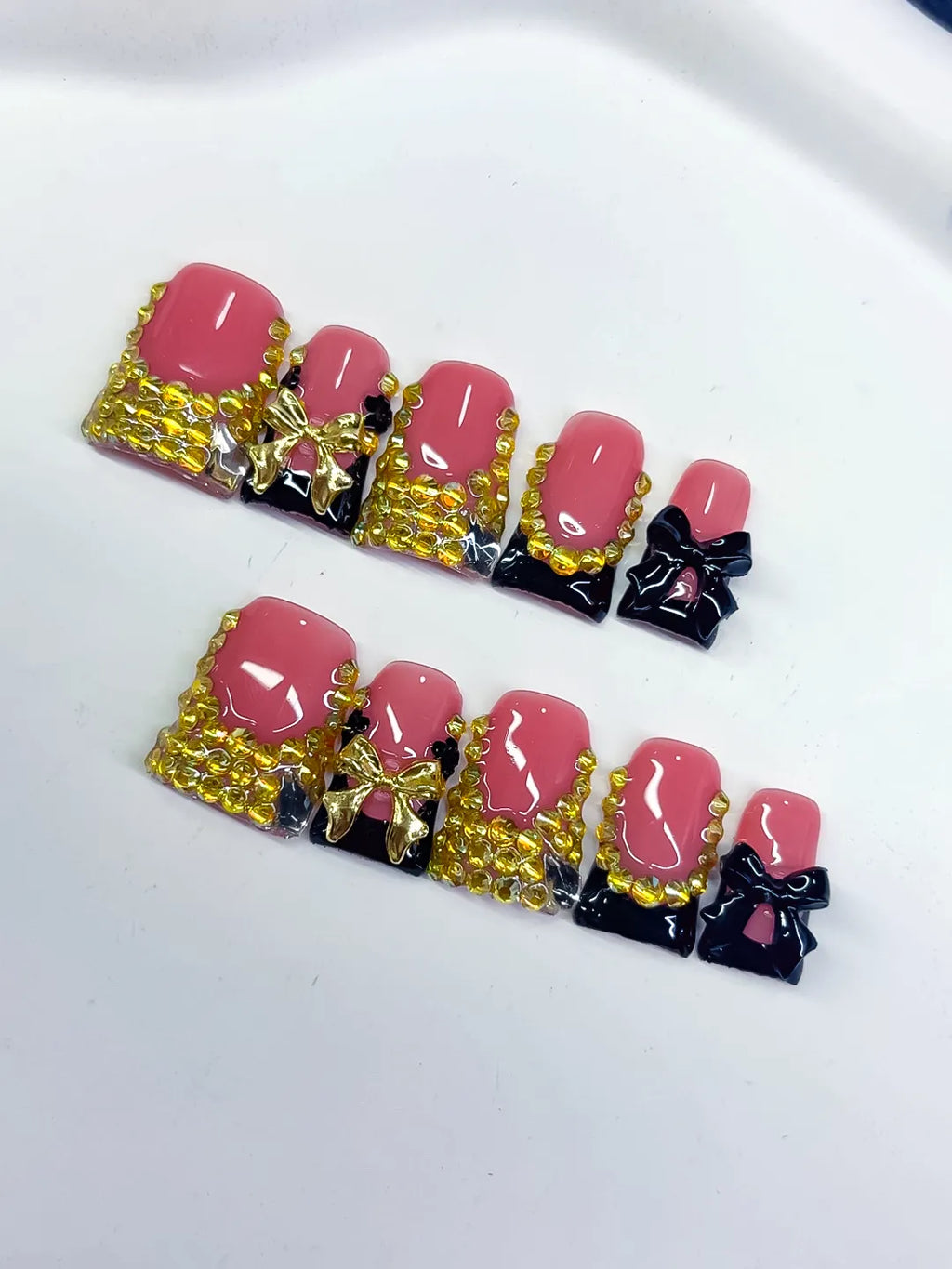 Pink Black Gold French tip Bow Rhinestone press on nails close up