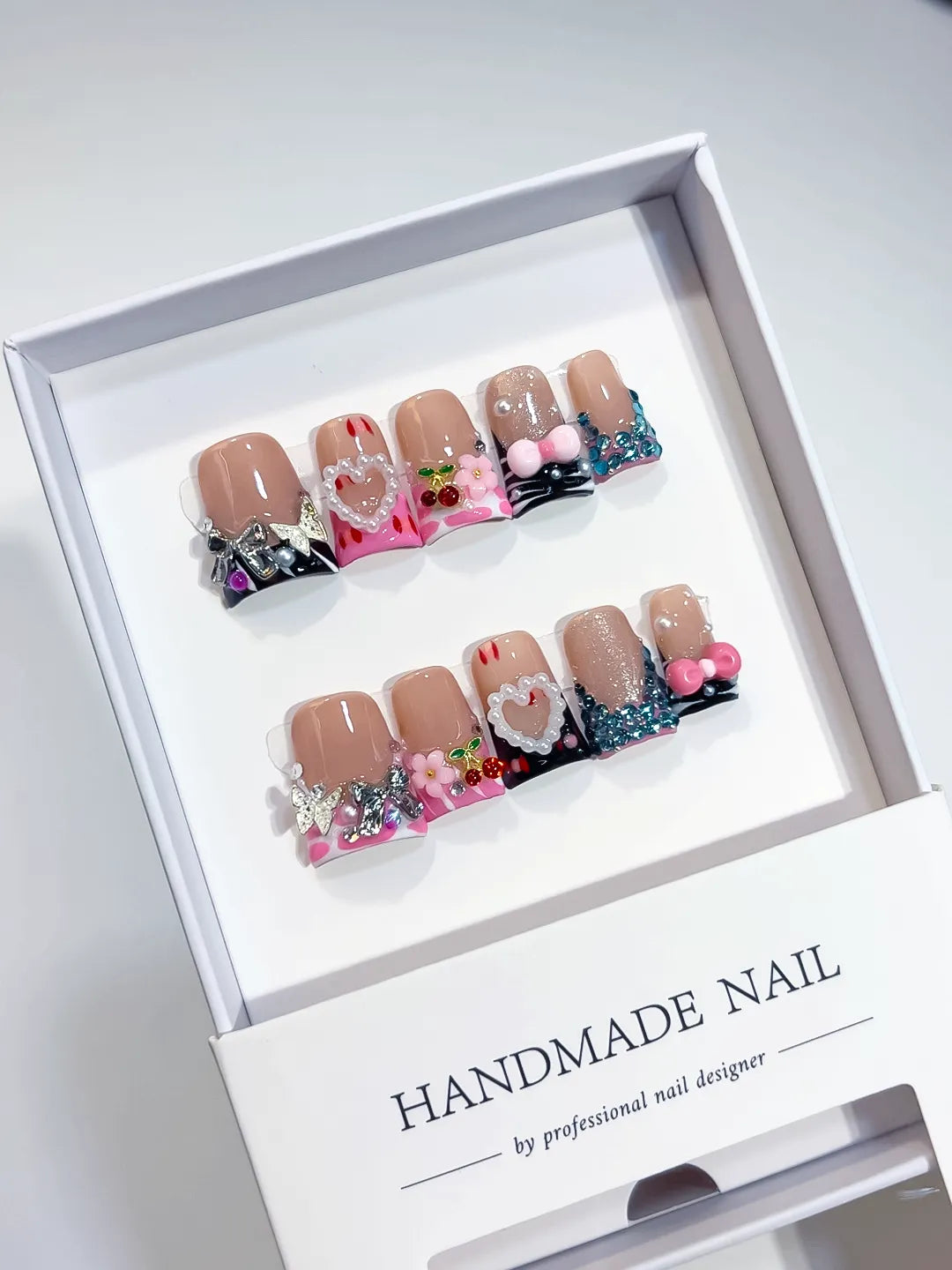 Nude Pink Black Blue Silver Abstract Heart Flower Cherry Rhinestone 3D press on nails angled view