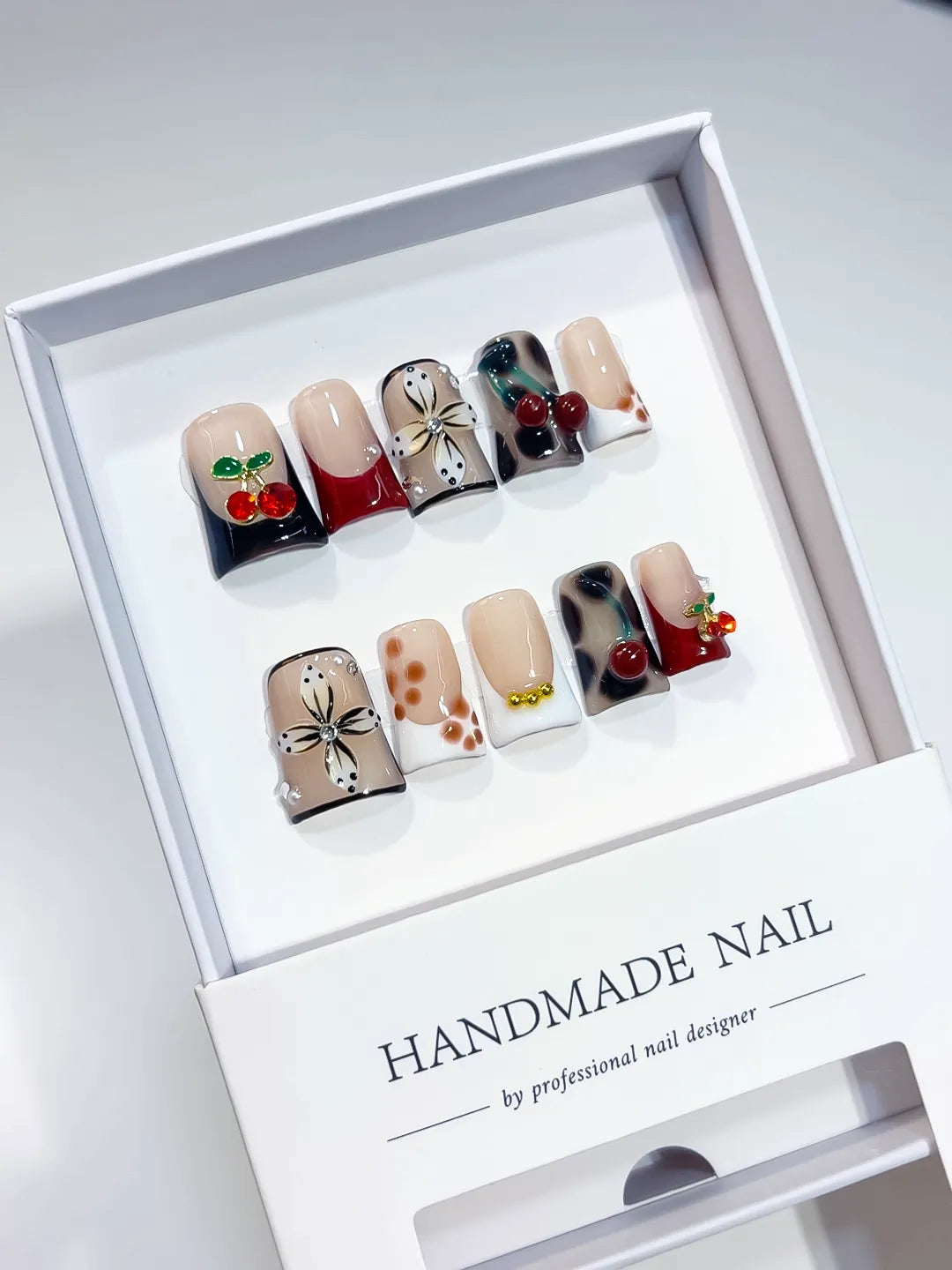 Nude White Black Red Gold Abstract Flower Cherry press on nails angled view