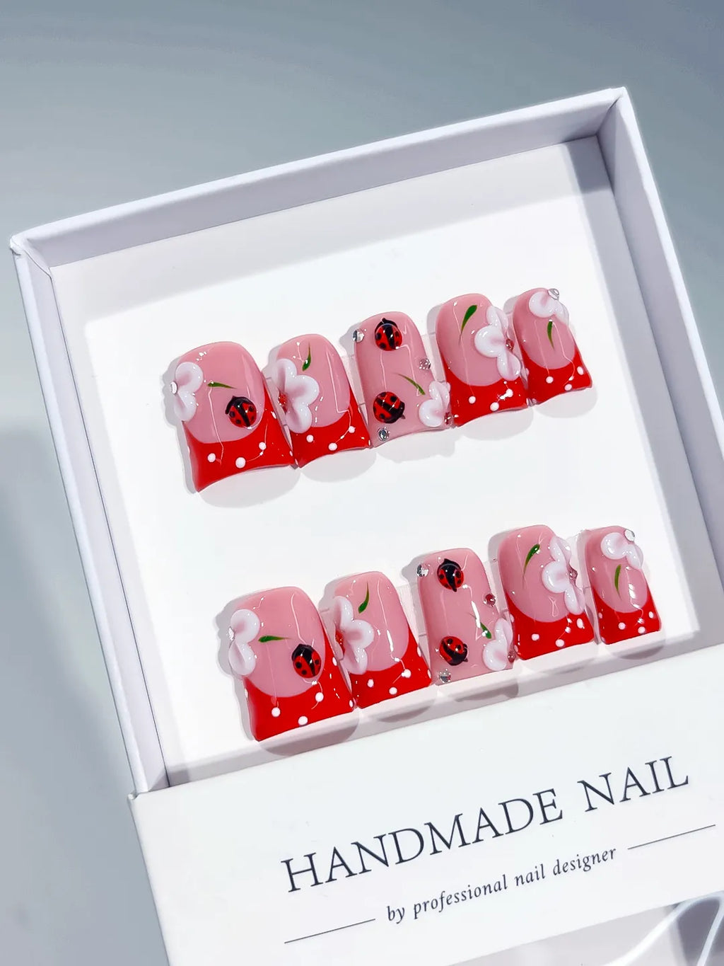 Pink Red White Abstract Ladybug Flower 3D press on nails angled view