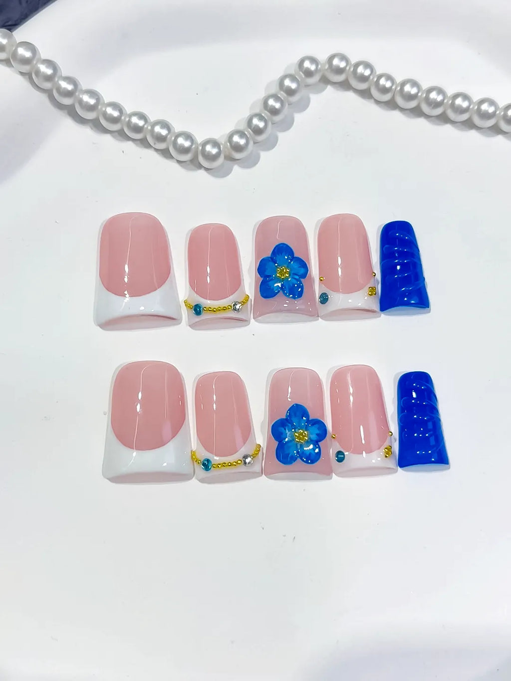 Pink White Blue Gold French tip Flower Rhinestone 3D press on nails close up