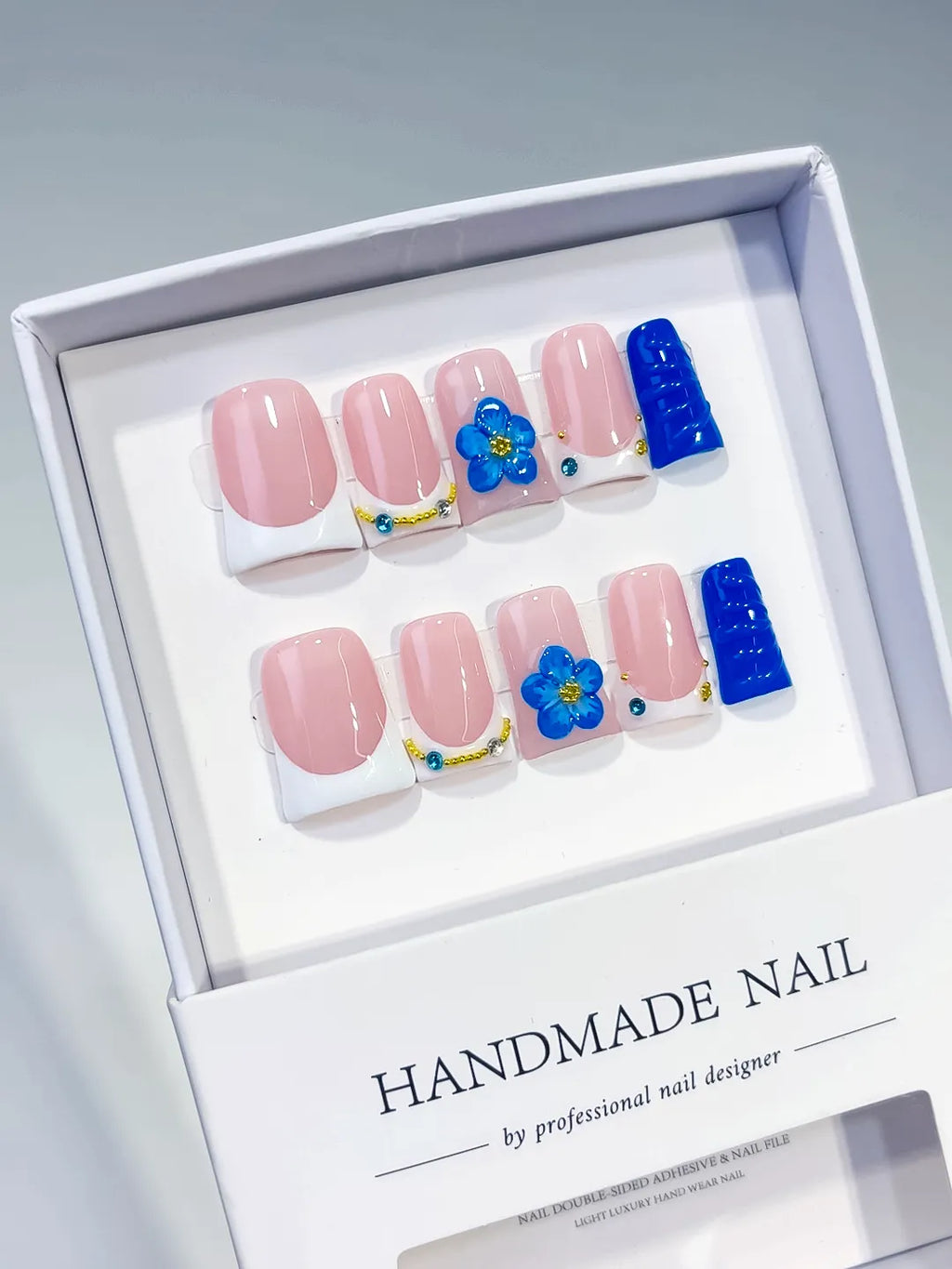 Pink White Blue Gold French tip Flower Rhinestone 3D press on nails angled view