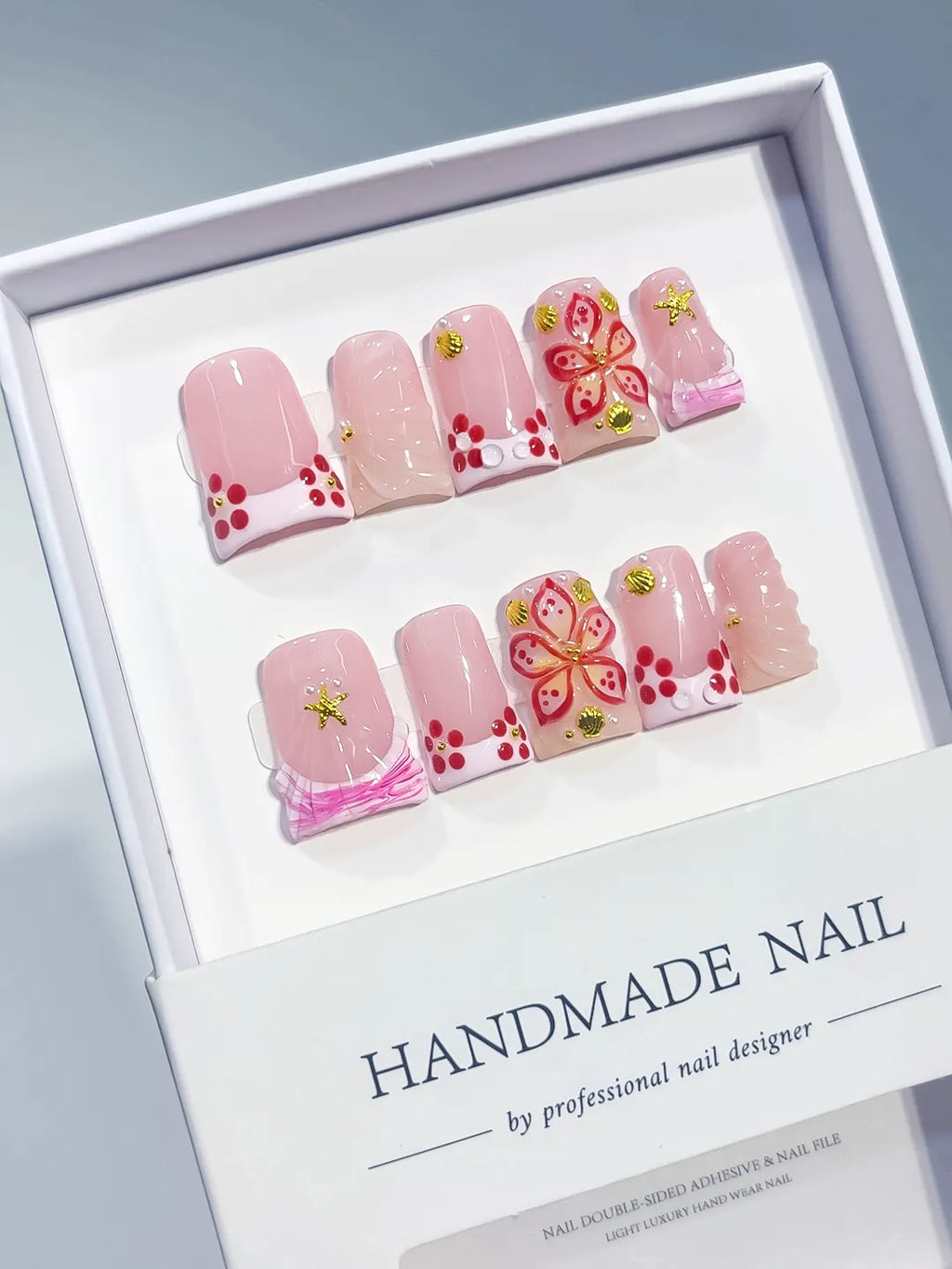 Pink White Gold Red French tip Butterfly Starfish 3D press on nails angled view