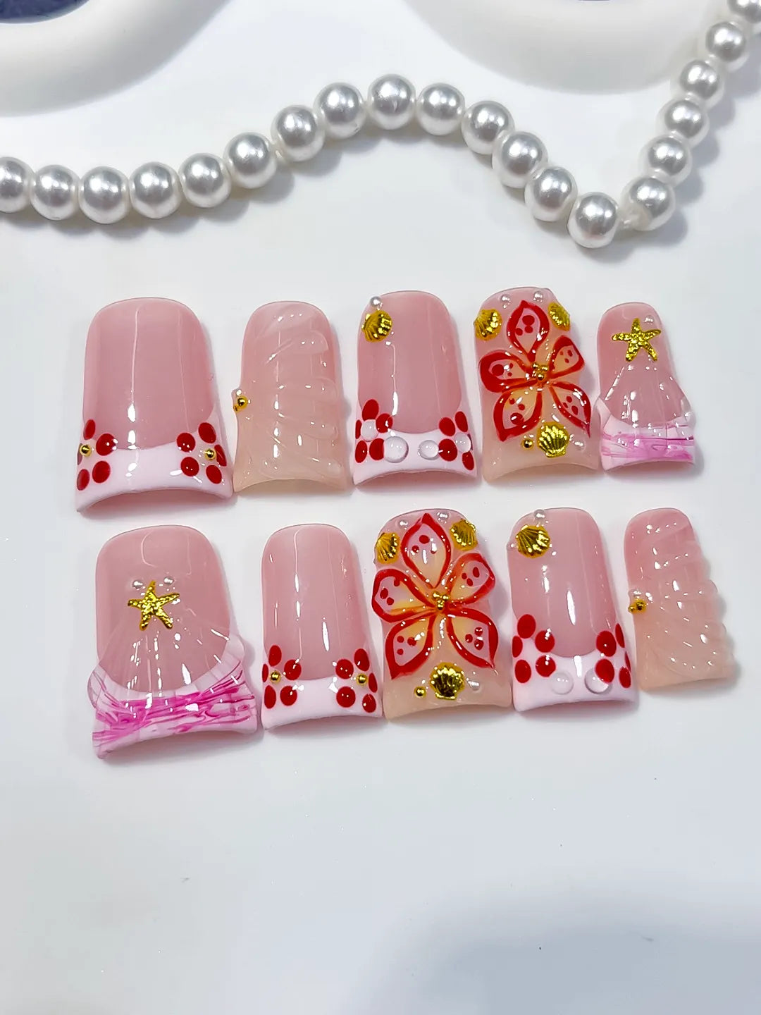 Pink White Gold Red French tip Butterfly Starfish 3D press on nails detail view