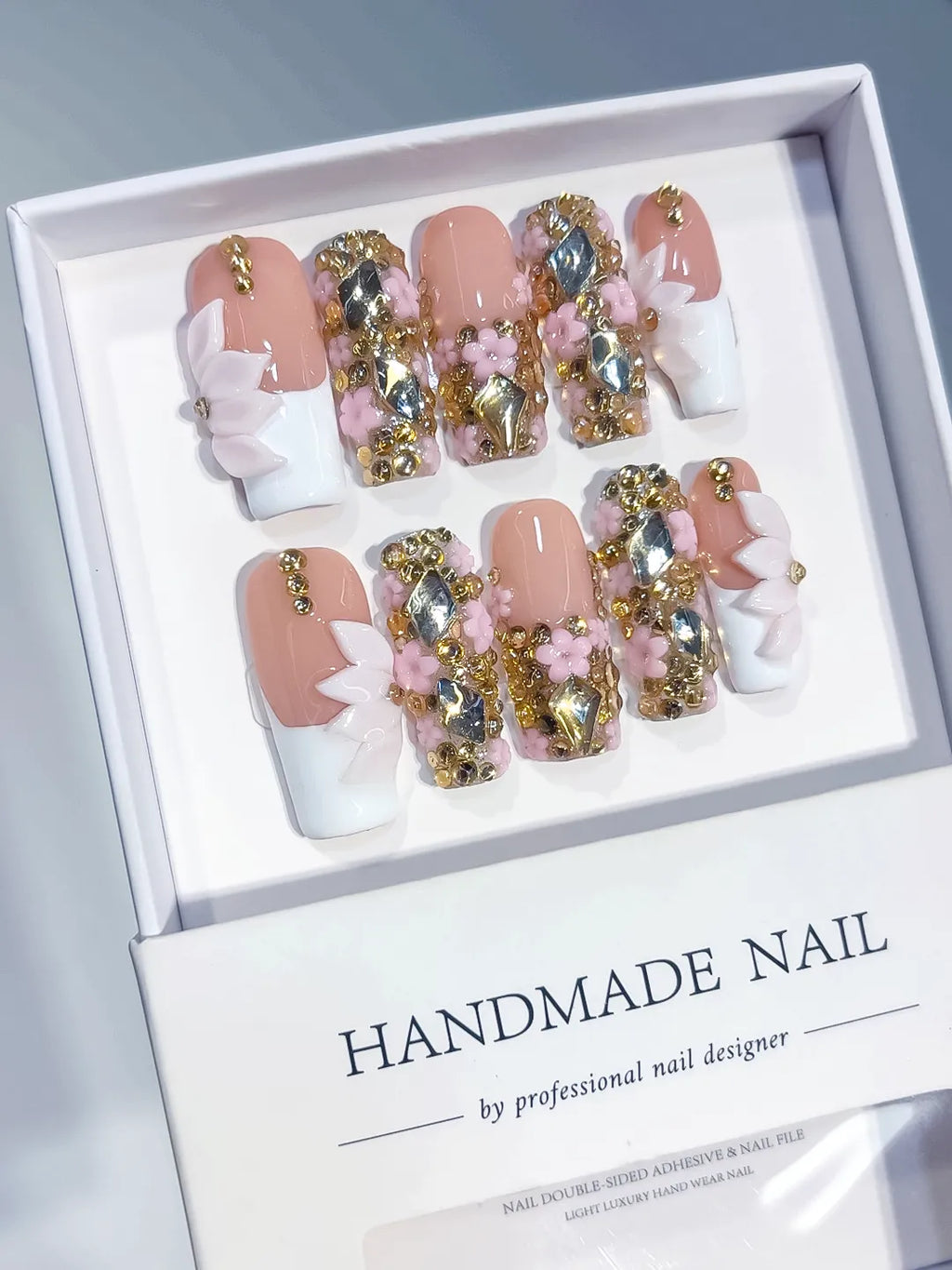 Nude White Gold French tip Flower Bow Rhinestone 3D press on nails angled view