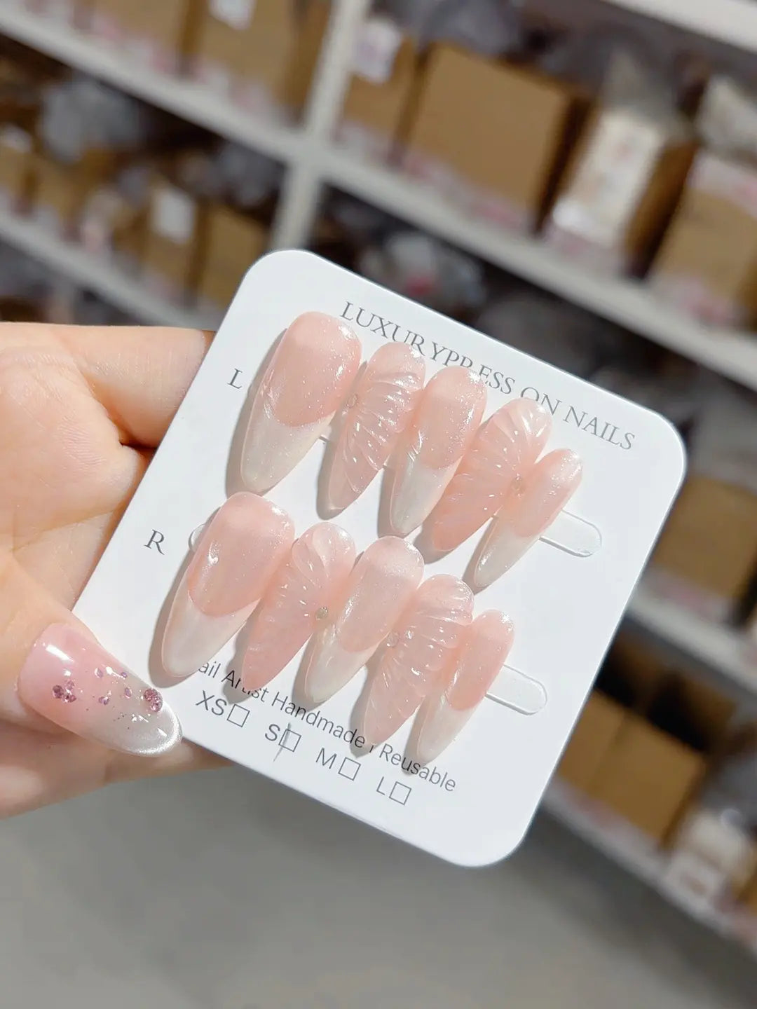 Long almond nude pink handmade press on nails with 3D swirl centerpiece