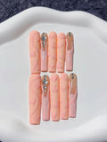 Long square pink handmade press on nails with textured 3D embossed heart designs.