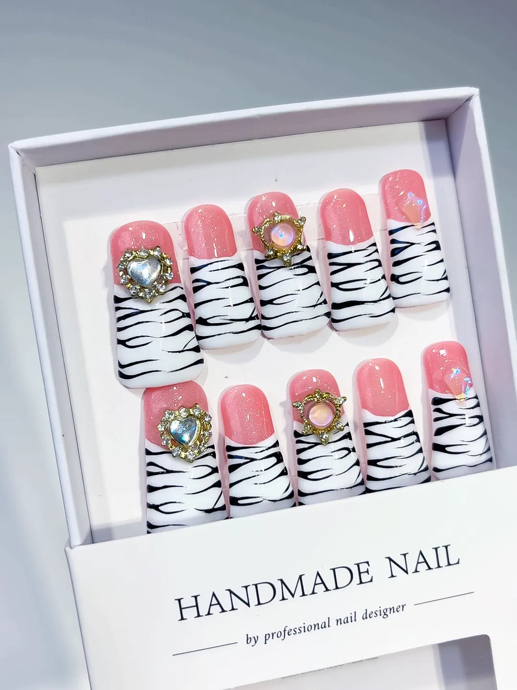 Pink White Black Abstract Animal Print press on nails angled view