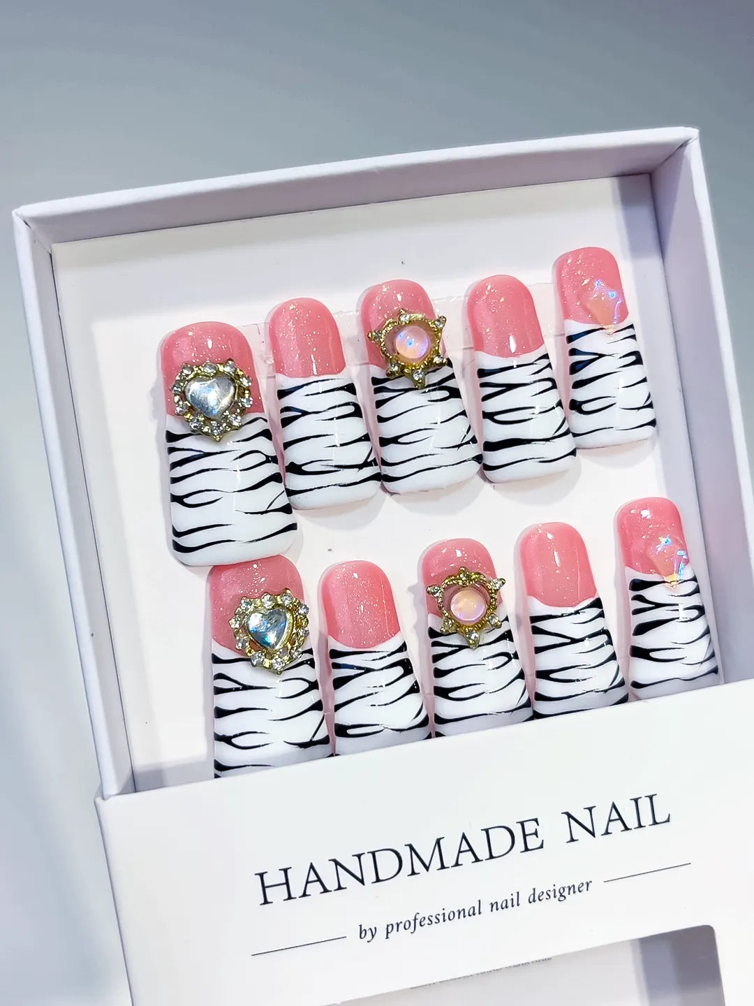 Pink White Black Abstract Animal Print press on nails angled view