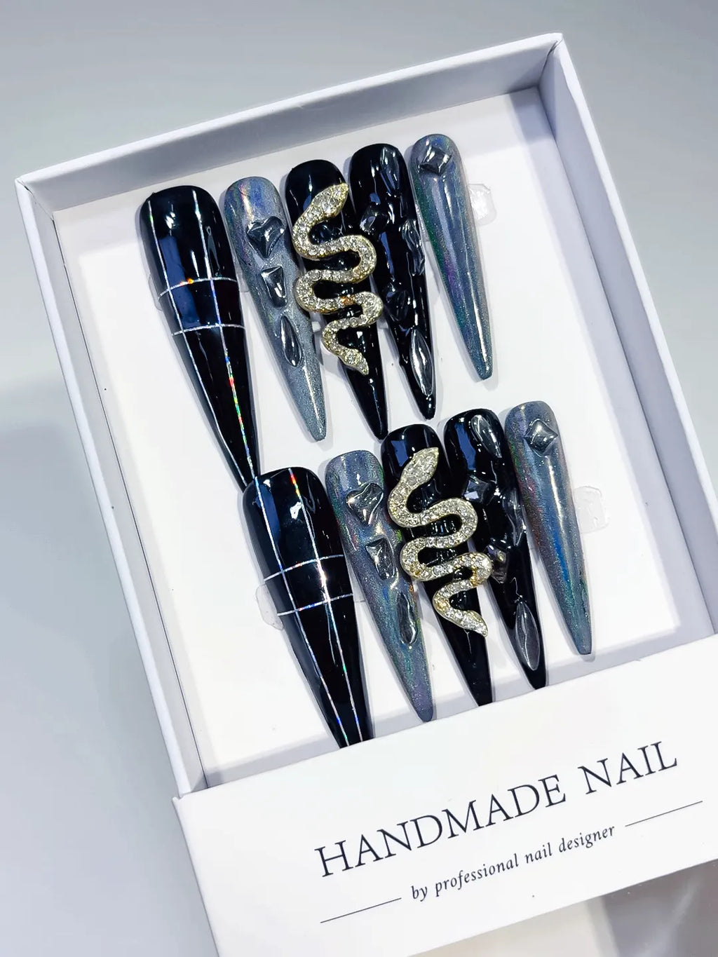 Black Silver Solid color Snake Rhinestone 3D press on nails angled view