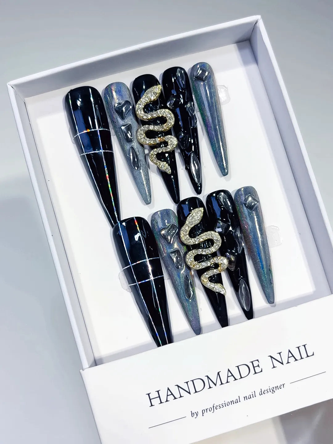 Black Silver Solid color Snake Rhinestone 3D press on nails angled view