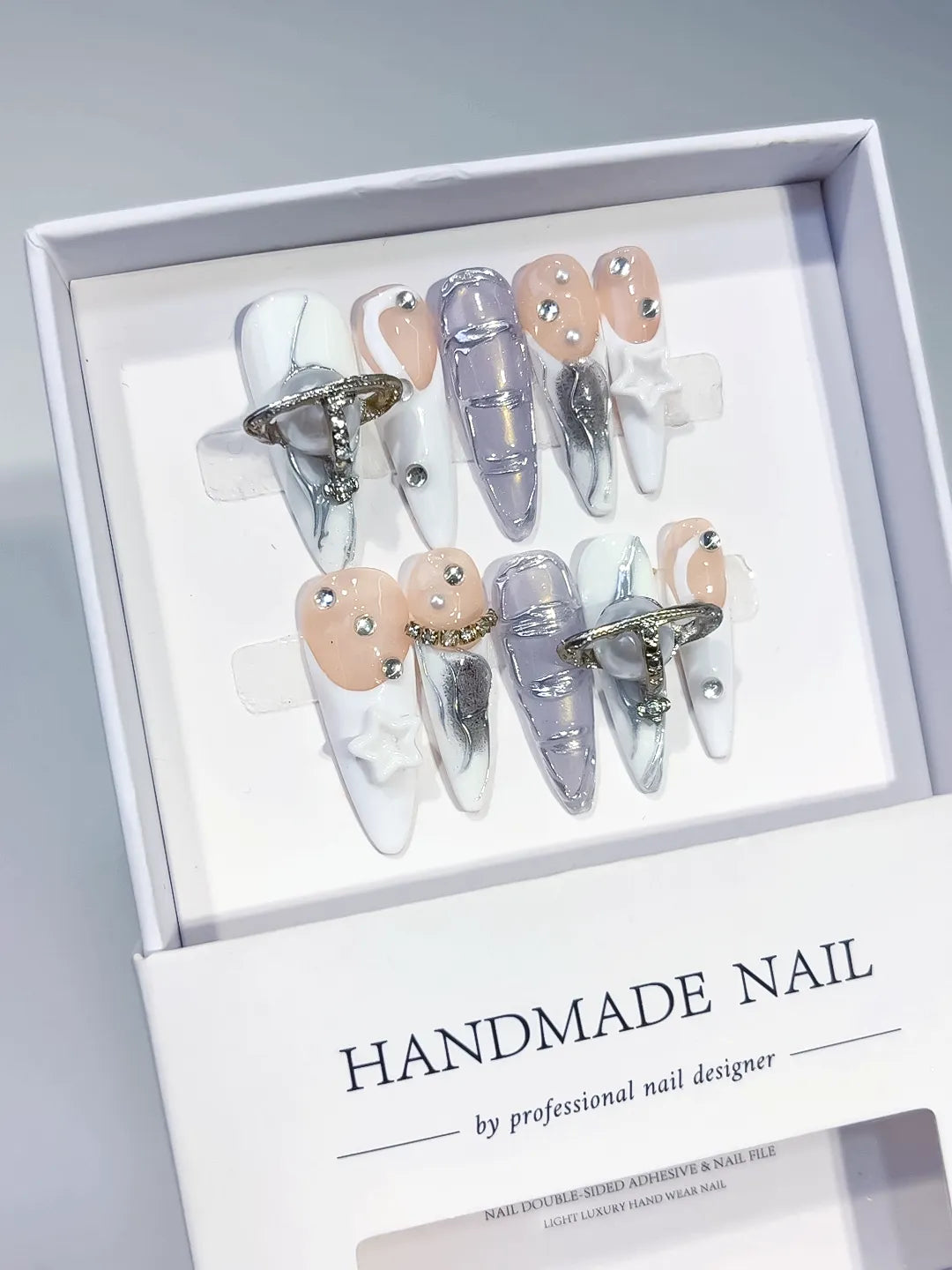 White Silver Solid color Bow Rhinestone 3D press on nails angled view