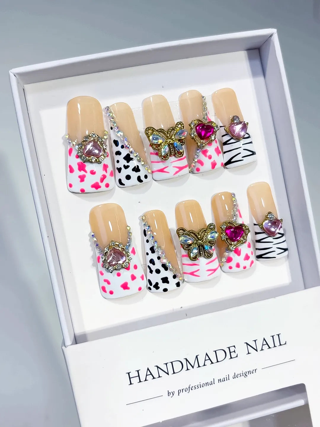 Nude White Pink Blue Abstract Flower Bow 3D press on nails angled view