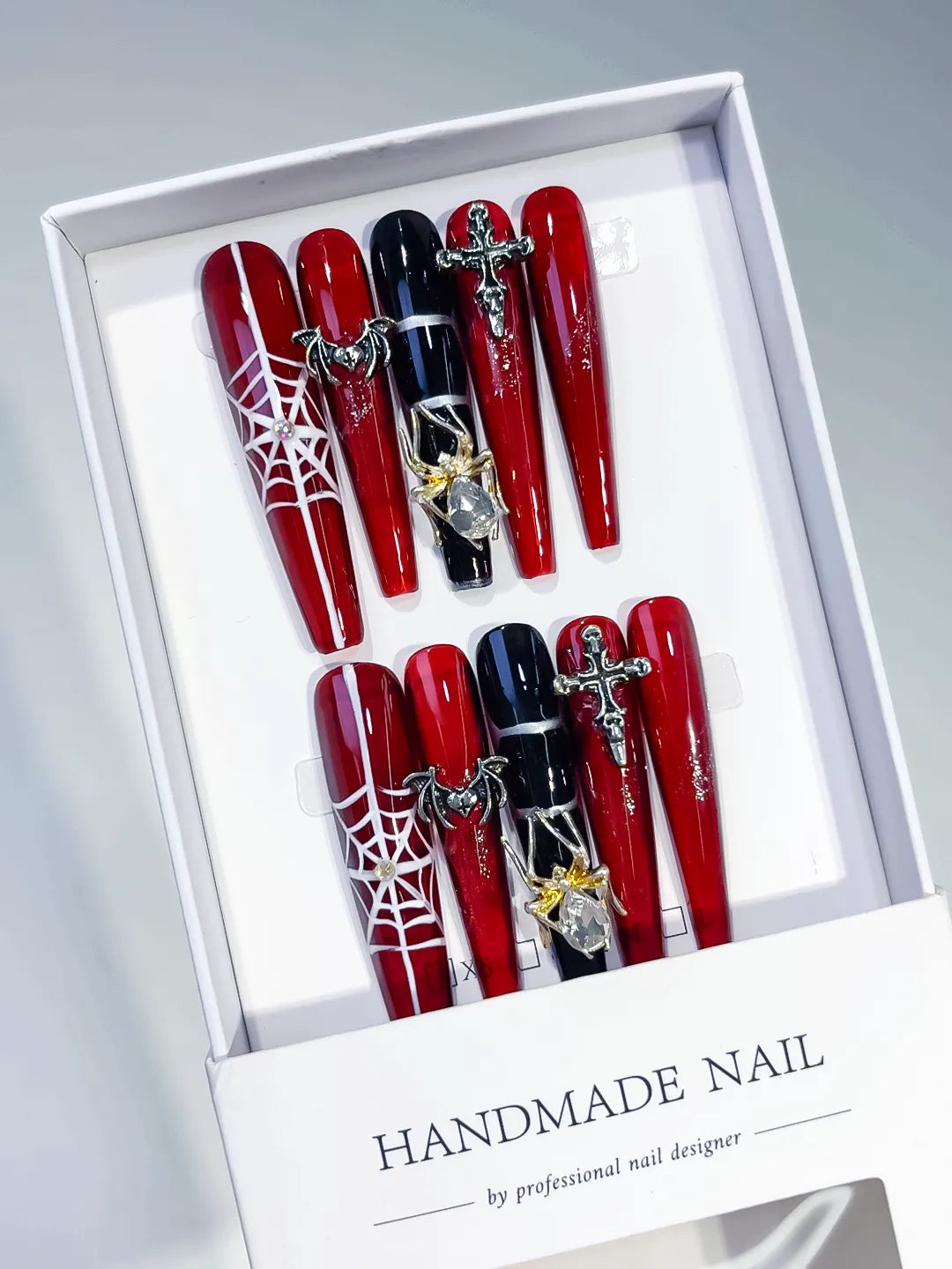 Red Black Silver Abstract Strap Stud Metallic Accent press on nails angled view