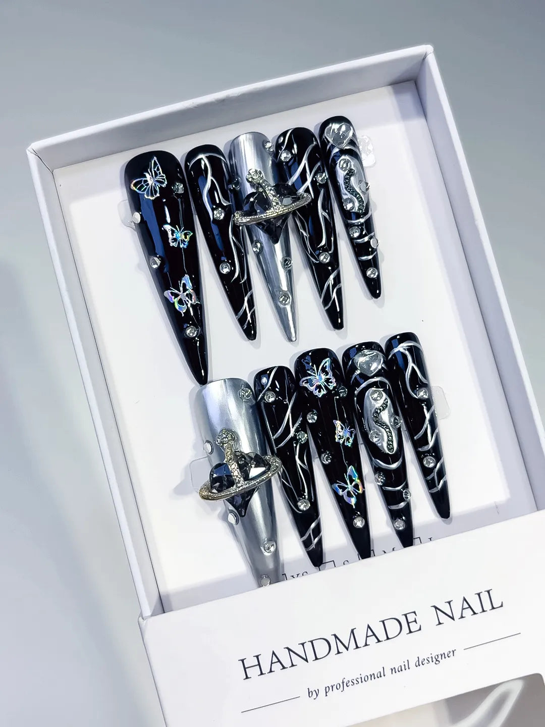 Black Silver Solid color Bear Rhinestone 3D press on nails angled view