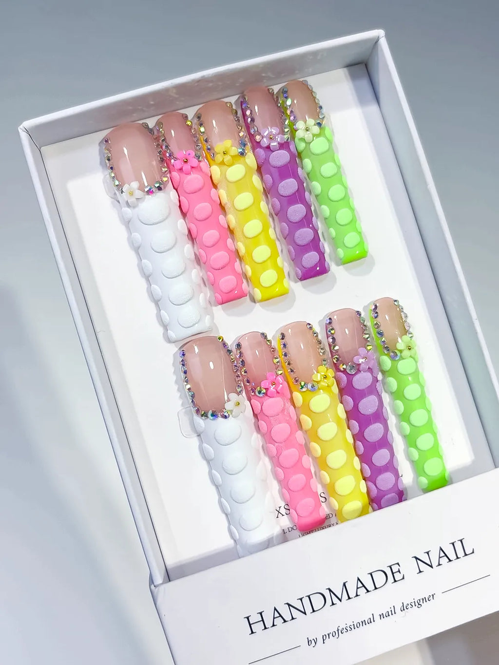 Nude Pink Yellow Green Abstract press on nails angled view