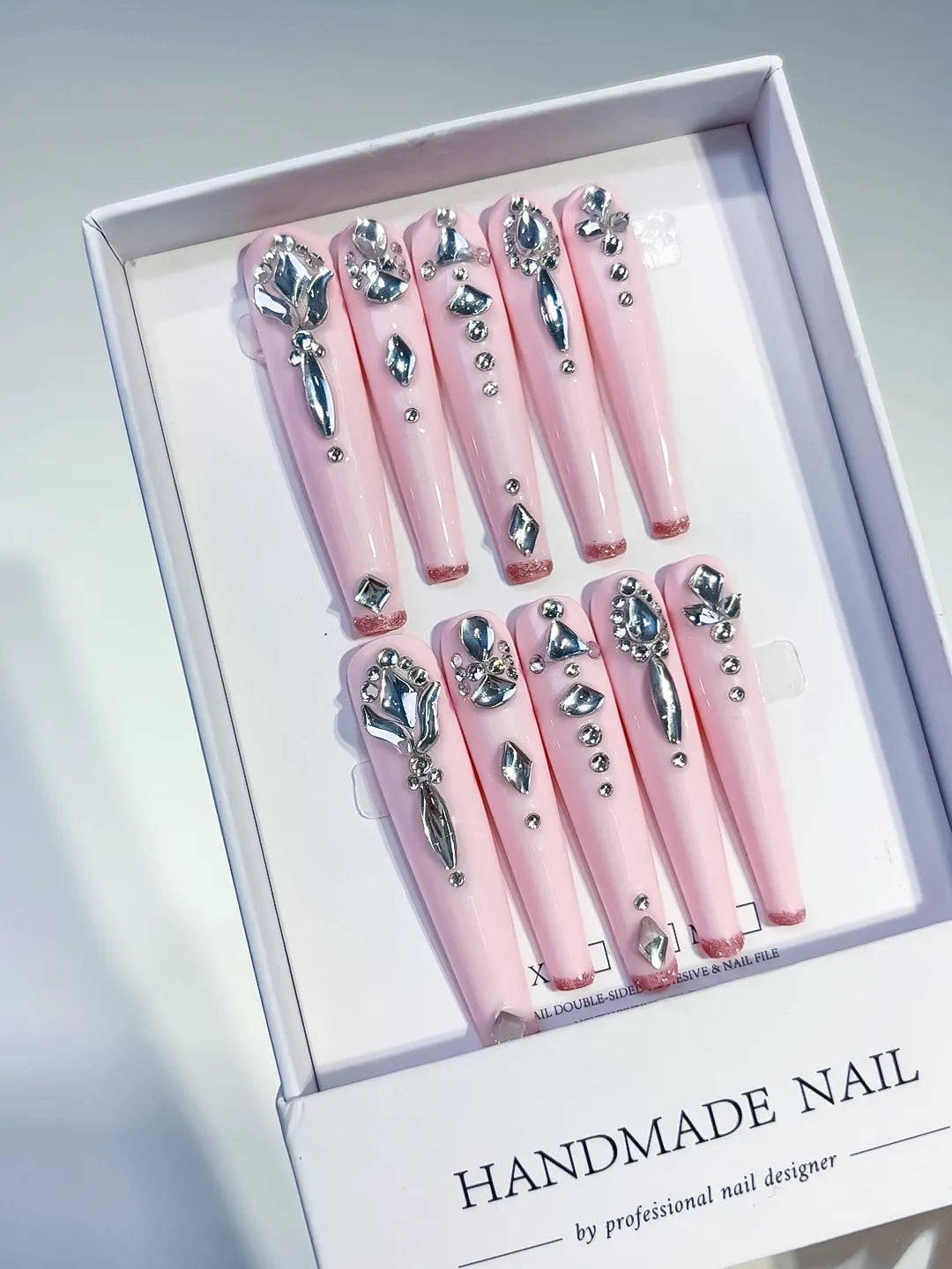 Pink Silver Solid color Bow Rhinestone 3D press on nails angled view
