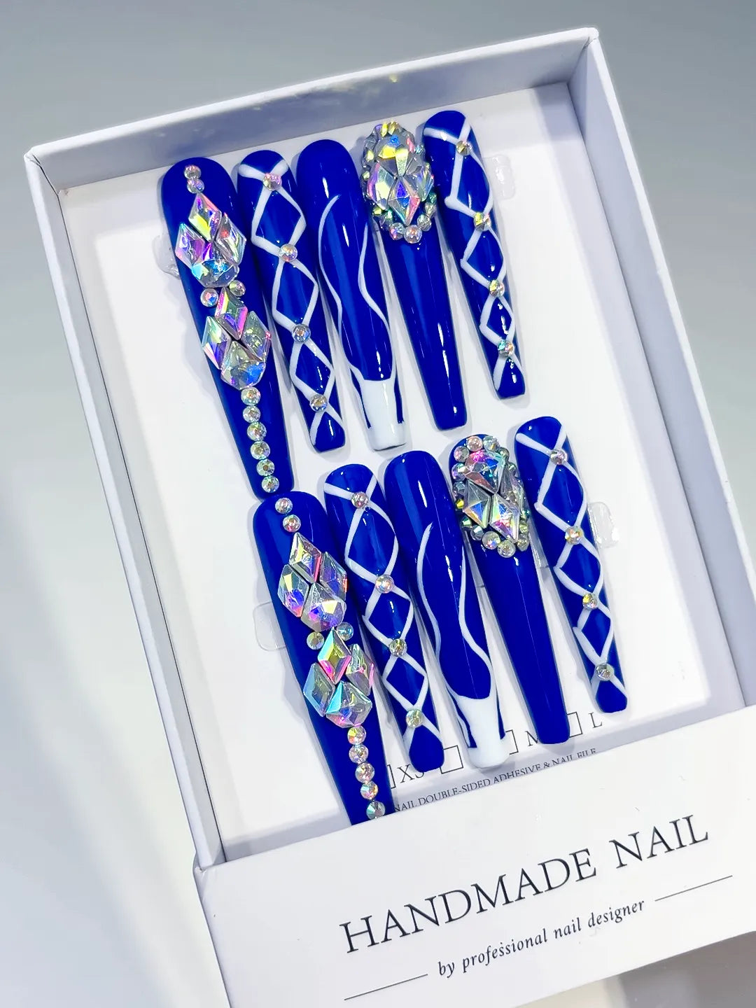 Blue Silver Abstract Linework Rhinestone press on nails angled view