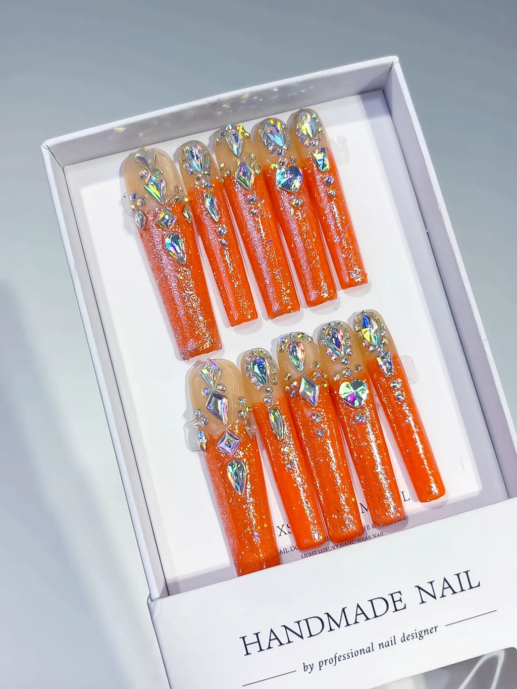 Orange Solid color press on nails angled view