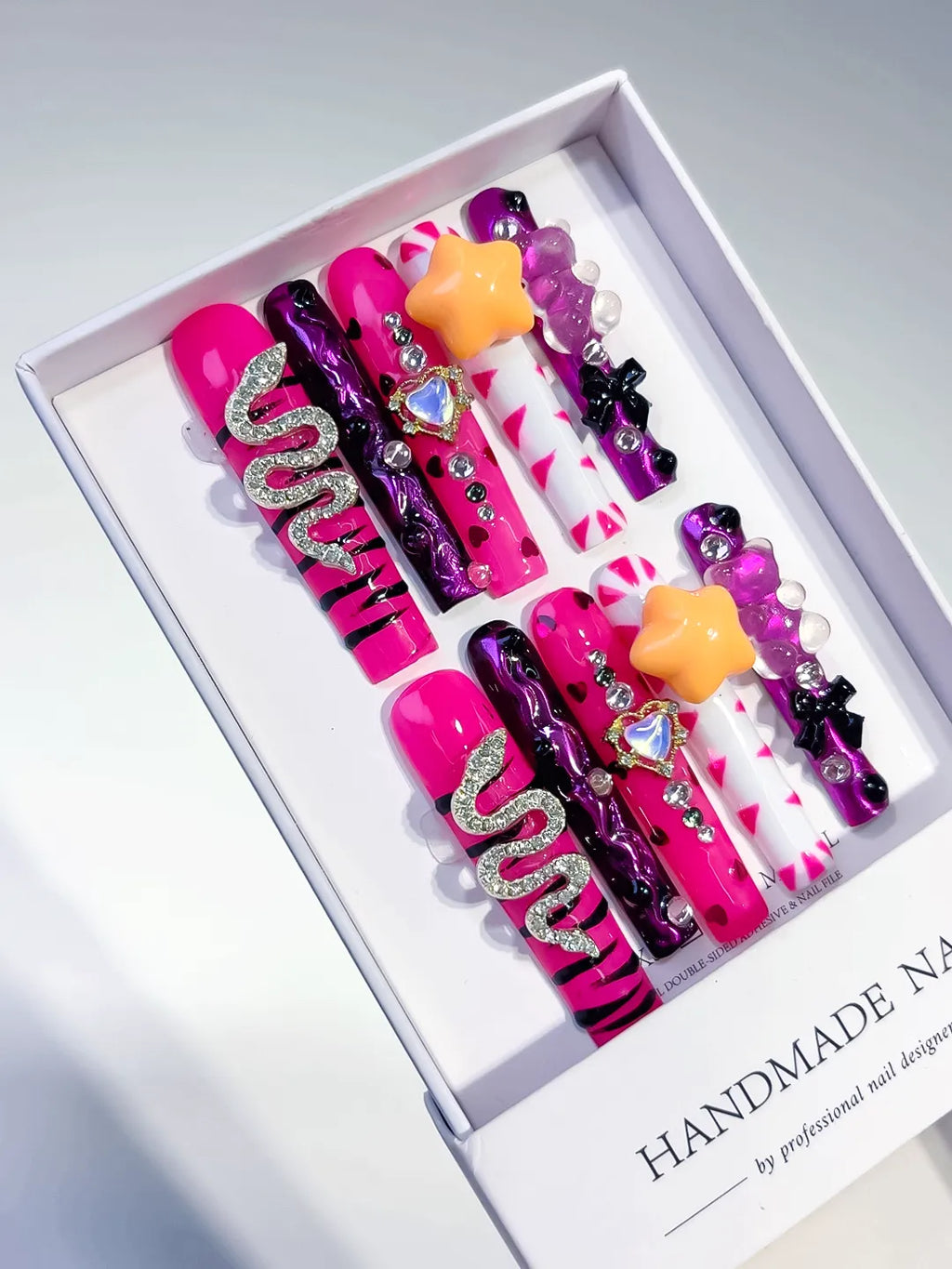 Pink Black Silver Yellow Abstract Flower Bow 3D press on nails angled view