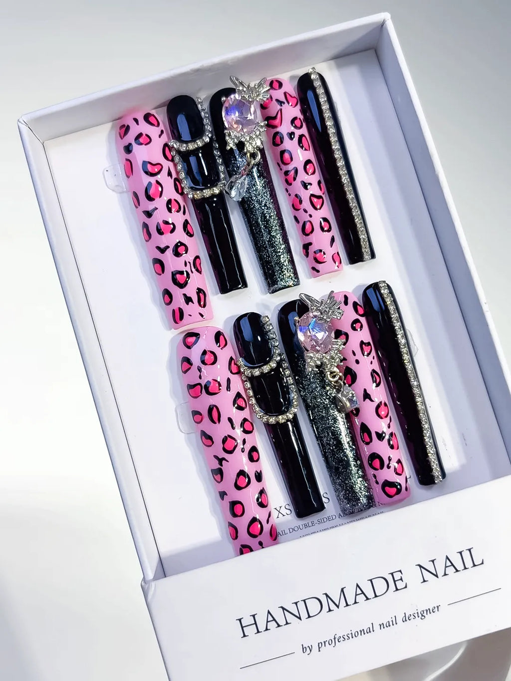 Pink Black Silver Abstract Animal Print Linework press on nails angled view