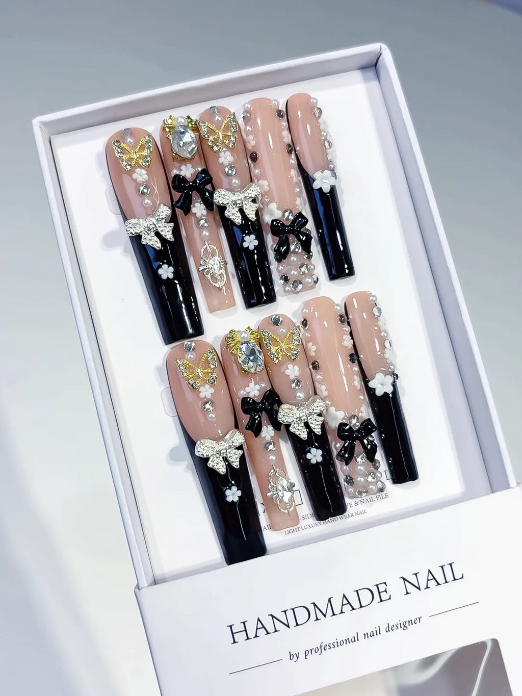 Nude Black White Gold Solid color Flower Rhinestone Metallic Accent press on nails angled view